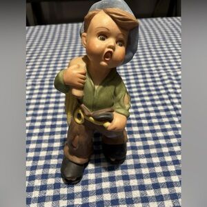 Charming Figurine with Blue Hat and Green Shirt
